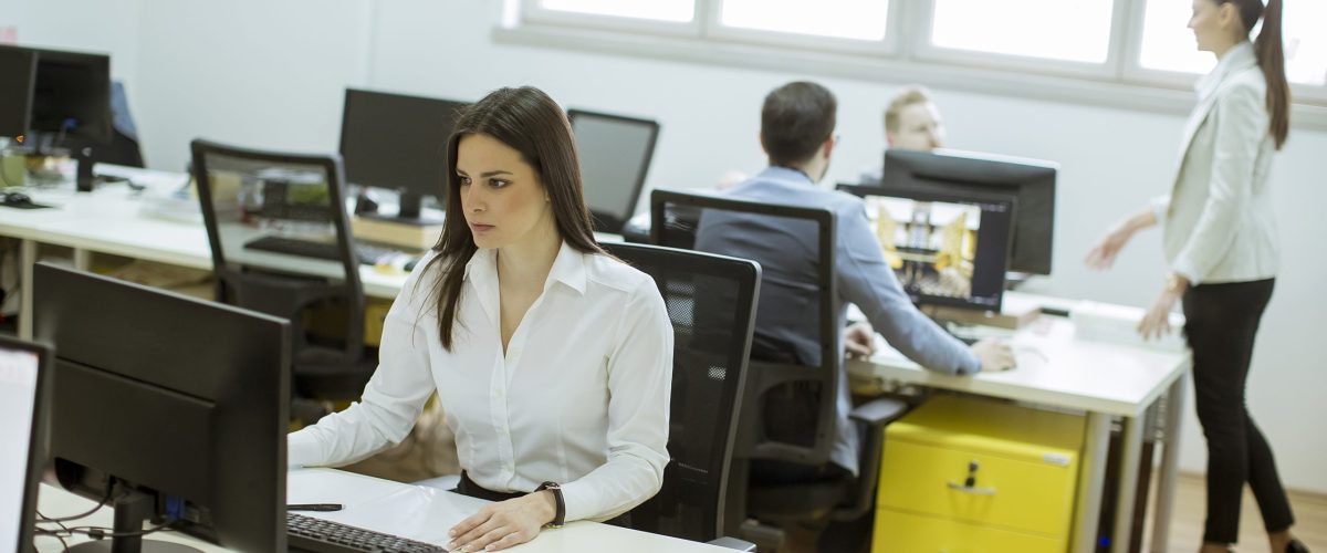 Group of young people working in the modern office