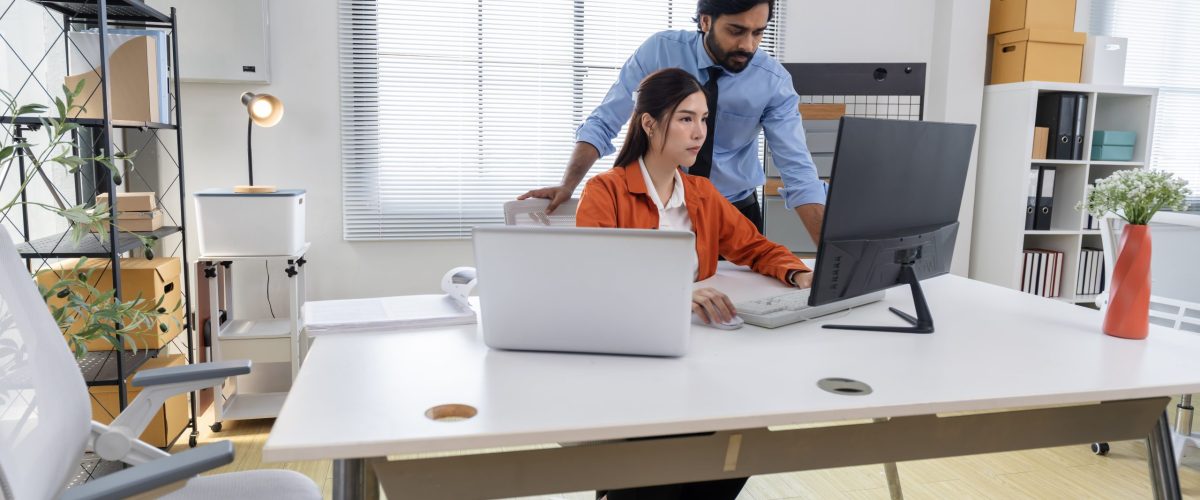 Business Professionals Discussing Project in Modern Office